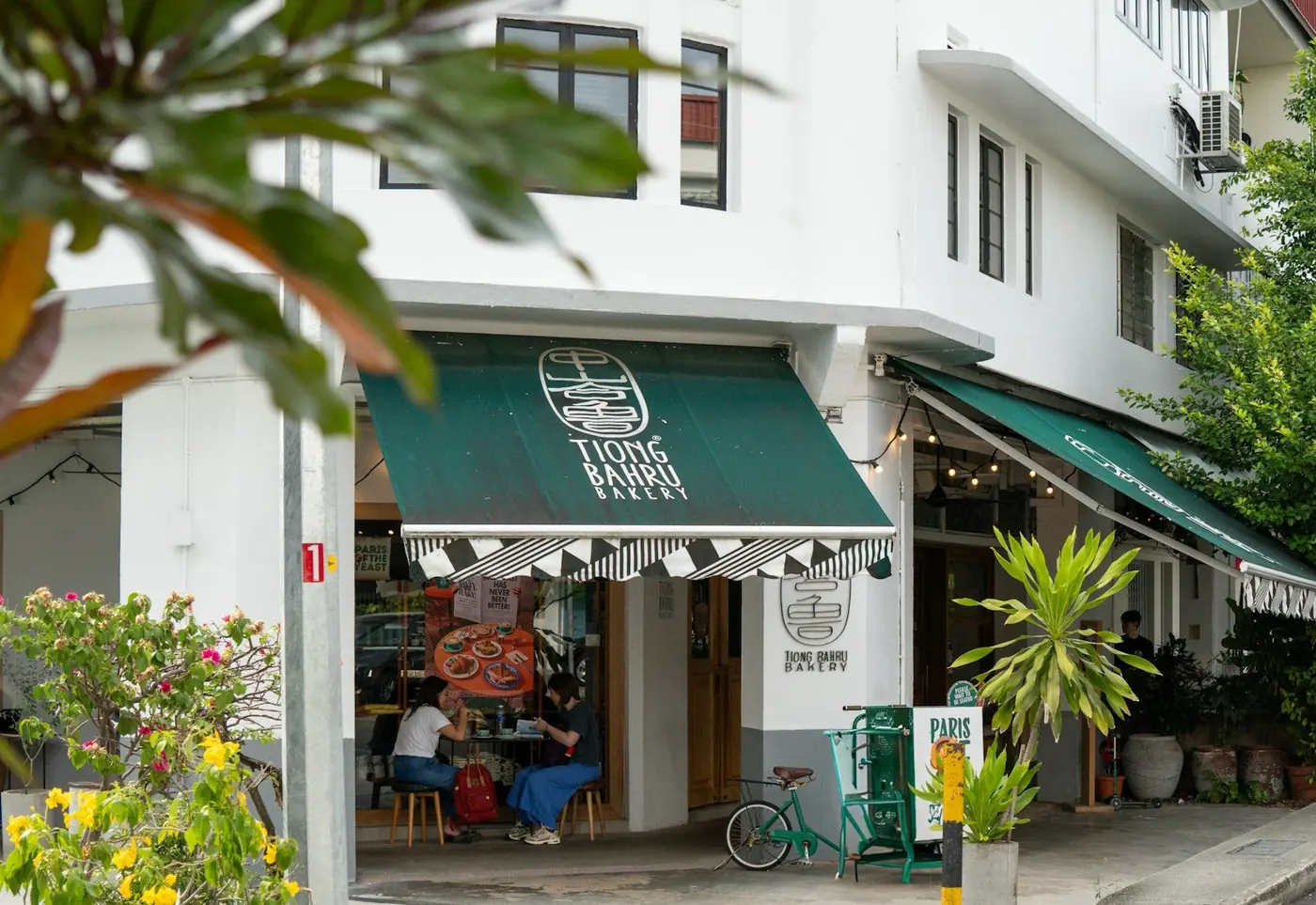 Shophouse street corner with green awnings in Tiong Bahru